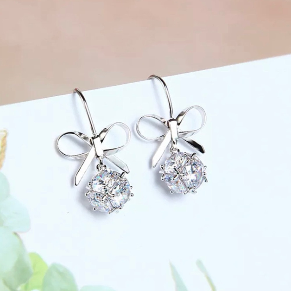 3/$30 Silver Bow Drop Earrings - Picture 6 of 8